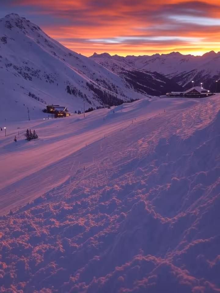 Luxury ski resort mountain peaks at golden hour with fresh powder snow, dramatic alpine sunset, excl