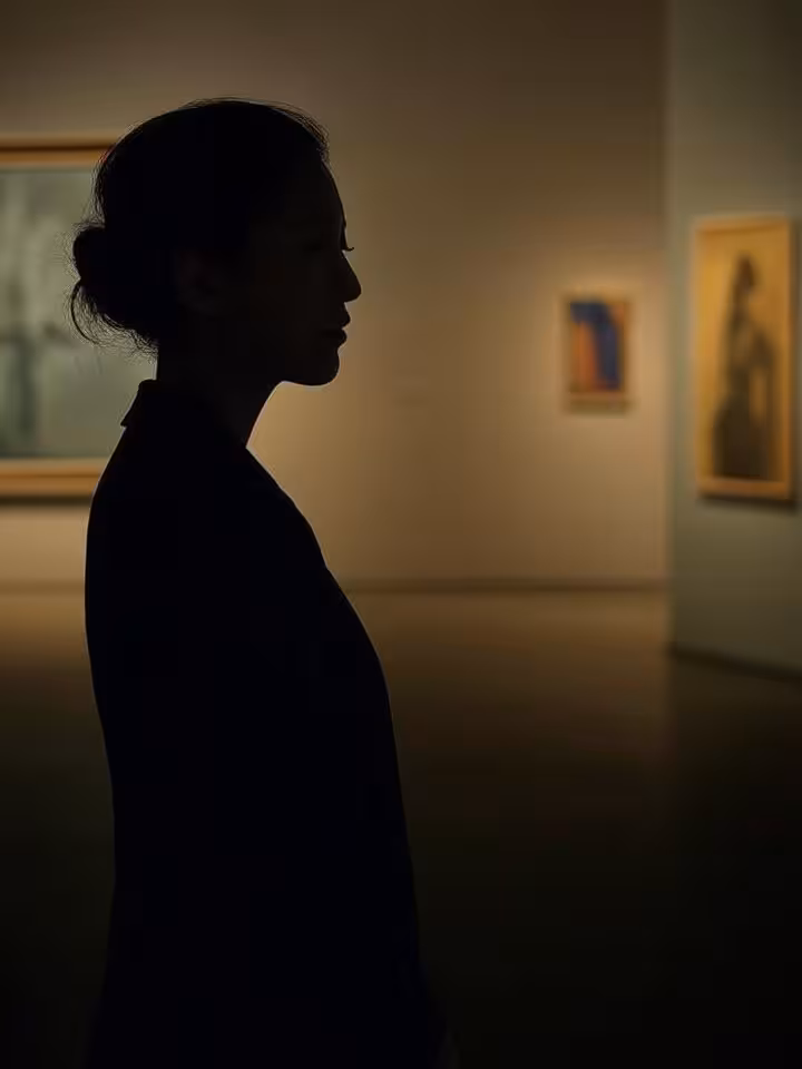 Woman's silhouette looking at art gallery wall, contemporary artwork, museum lighting, sophisticated